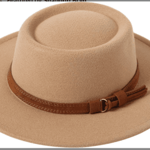 The Tan Circle Top W Brown Band is a beige felt hat with a wide brim, a brown leather band featuring a buckle and decorative tassels.