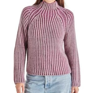 A person wearing a Plum & Light Purple Braid Pattern Sweater with long sleeves and light blue jeans.