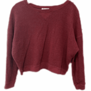 The Burgundy Fuzzy Sweater features a loose fit, long sleeves, wide neckline, and ribbed cuffs, shown against a plain white background.