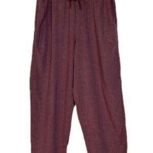 A pair of loose, maroon pants with an elastic waistband.