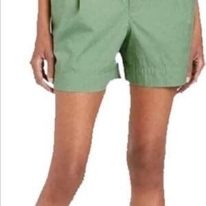 Person wearing Elastic Waist Shorts in green paired with a matching green shirt.