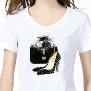 A woman wearing a white T-shirt printed with a design of a black high-heeled shoe, a black clutch purse, and white and black flowers.
