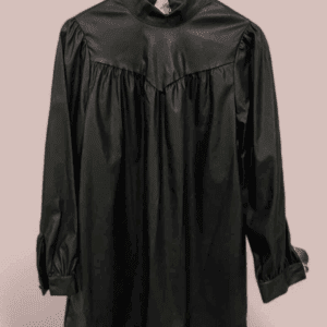 The Black Long Sleeve Faux Leather Dress features a high neckline and gathered detailing, shown on a wooden hanger against a light pink background.