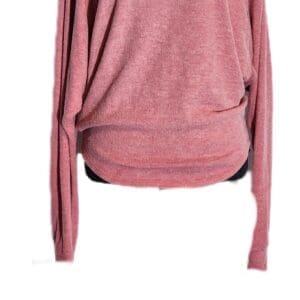 A pink off-the-shoulder long sleeve top displayed on a black mannequin against a white background.