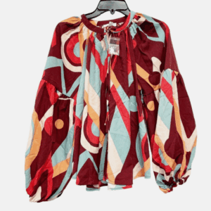 A Burgandy & Red Colorful Button Down String Tie Neck blouse with bold geometric patterns, long sleeves, shown on a hanger against a white background.