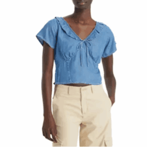 A person wearing a Denim Slim Fit Top and beige high-waisted pants.
