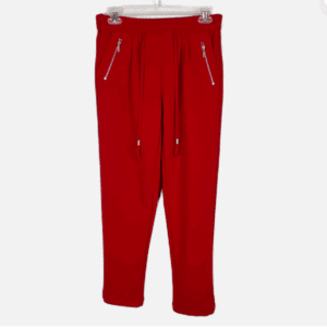 Red Zipper Pocket Work Pants featuring a drawstring waistband and two zippered front pockets, displayed on a hanger against a plain background.