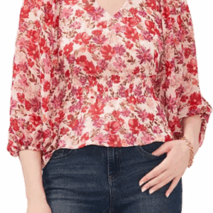 Woman wears the Red & Purple Flower Gathered Waist Long Sleeve Top with a V-neck and blue jeans.