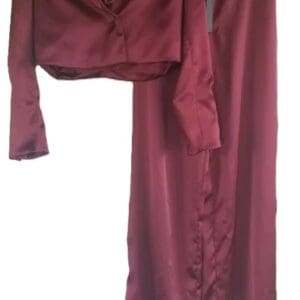 A maroon satin two-piece outfit with a cropped blazer and high-waisted wide-leg pants hanging on black hangers.