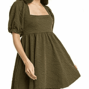 Woman wearing an olive green, short puff-sleeve, square-neck dress with a flared skirt, standing against a plain white background.