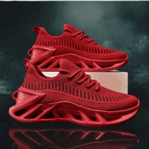 A pair of red athletic sneakers with a mesh upper and a thick, sculpted sole are displayed one on top of the other against a dark background.