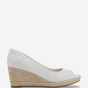 A white eyelet wedge shoe with an open toe and a braided jute platform heel, viewed from the side against a white background.