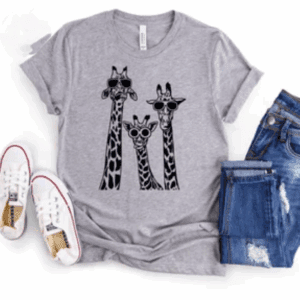 Gray t-shirt with a graphic of three giraffes wearing sunglasses, paired with blue jeans and white sneakers.