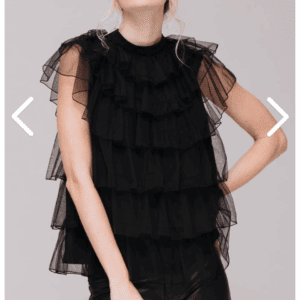 Person wearing a Black Ruffle Short Sleeve Top paired with black leather pants, standing against a neutral background.