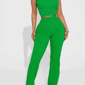 A woman wearing the Bubble Pants and Crop Top Set, featuring a bright green textured strapless crop top and matching high-waisted pants, stands against a white background.