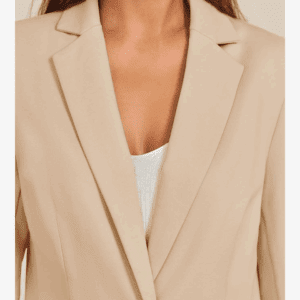 A woman shown from shoulders to mid-torso wears the Khaki Blazer over a white top.