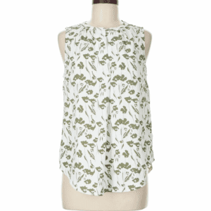 Sleeveless Blouse in white with a green floral print, shown on a dress form against a plain background.