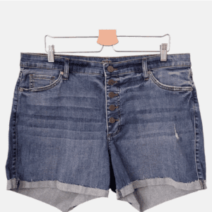 Jean Shorts with rolled raw hems, visible front buttons, five pockets, and slight fading in blue denim, displayed on a metal hanger.