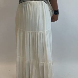 A woman wearing a white dress.