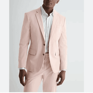 A man wearing a Striped Blazer and a white dress shirt stands against a plain white background.
