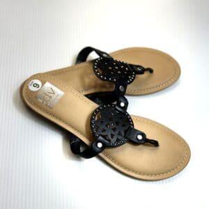A pair of Strappy Sandal for women in tan with black decorative cutout straps, displayed on a white surface.