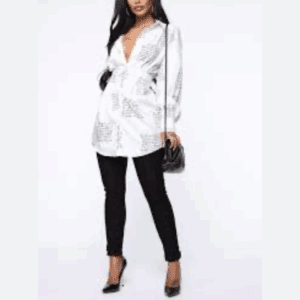 Model wearing the Letter Shirt Dress (Copy), a white long-sleeve shirt dress with text print, styled with black pants, black high heels, and a black quilted handbag against a plain white background.