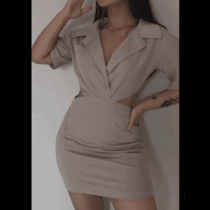A woman models the Cut Out Sides Dress, a fitted beige short-sleeve dress with a collar and side cutouts, against a plain background.