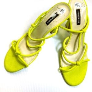 The Strappy Sandal by Nine West is a pair of lime green women's heeled sandals featuring an open toe and strappy design, shown on a white background.