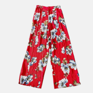 Sheer Cover Up Pants in red, featuring a wide-leg design and a white, blue, and yellow floral pattern, displayed flat on a white background.