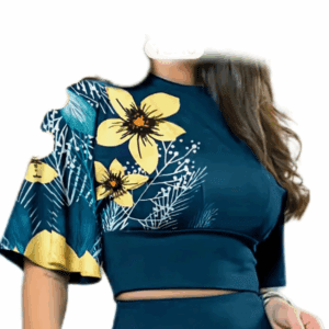 A woman wears the 2pc Yellow Flower Pants Set, featuring a dark teal matching top and high-waisted pants with large yellow floral prints, short ruffled sleeves, and leafy accents.