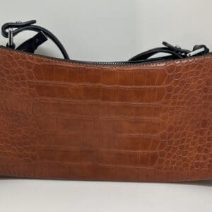 The Faux Small Alligator Purse features brown faux crocodile leather with black trim and metal hardware, displayed against a plain white background.