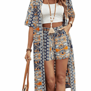 Woman wearing the Long Short Sleeve Fall Color Cardigan in a blue, orange, and white pattern with matching shorts, a white crop top, beaded necklace, bracelets, and holding a woven bag.