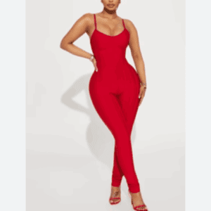 A woman poses in the Off the Shoulder Be Bold Top paired with red high-heeled sandals against a plain white background.