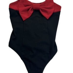 The Two Toned Spaghetti Body Suit is a black one-piece with thin straps, a bold red bow across the chest, and a contrasting red top panel.