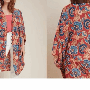 Woman wearing a loose, red kimono-style cardigan with blue and beige floral patterns, paired with a pink top and white pants, shown from the front and back.