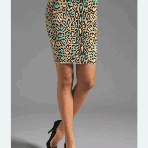 A person wearing the Simone Body Con Skirt, featuring a fitted, knee-length design with a tan, black, and turquoise leopard print pattern, paired with black pointed-toe heels.
