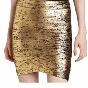 A person wearing the Simone Body Con Skirt, a shiny gold and black textured mini skirt with a black waistband, photographed from waist to mid-thigh.