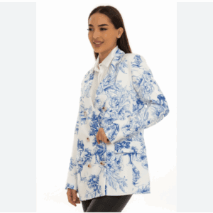 Woman wearing the 2 PC Off the Shoulder Top and Pants Set, featuring a white off-shoulder top with blue floral patterns and matching black pants, standing against a plain white background.