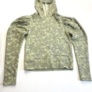 A green camouflage-patterned hoodie with long sleeves and a hood, laid flat on a white surface.