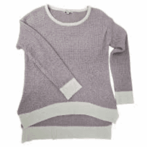 The Soft Knit High Low Sweater is a long-sleeve, light purple waffle-knit top with white ribbed cuffs, hem, and neckline, shown laid flat on a white background.