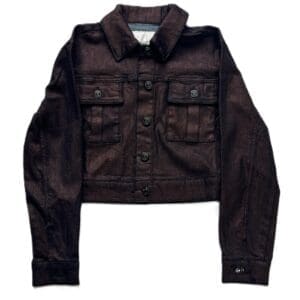 The Juicy Couture cropped dark brown denim jacket features long sleeves, a buttoned front, and two chest pockets, displayed flat on a white background.