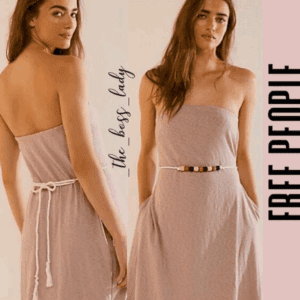 Two women model a strapless, light-colored dress with different belts. The text reads “the boss lady” and “FREE PEOPLE” along the side.