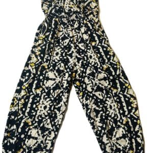 Product: Sleeveless black and white patterned jumpsuit with spaghetti straps and loose, gathered legs, shown on a white background.