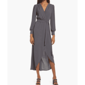 A woman wears Product, a long-sleeved dark gray wrap dress with a V-neck, belted waist, and front slit, styled with heeled sandals.