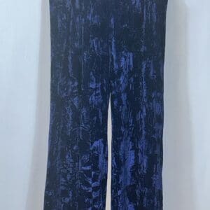 The Product is a pair of high-waisted, wide-leg, deep blue velvet pants displayed against a plain white background.