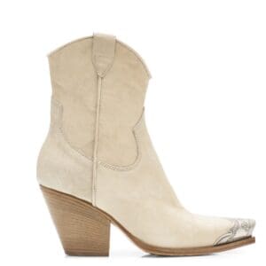 A beige suede western-style ankle boot with a pointed toe, decorative stitching, wooden block heel, and metal detailing on the toe.