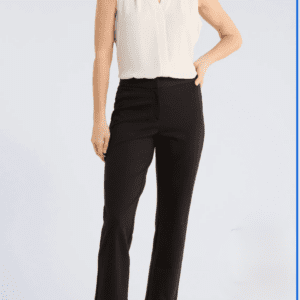 A person wearing a Cream Sleeveless Blouse SIZE M, black trousers, and black heels stands against a plain light background.