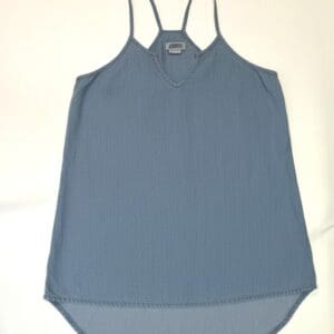 A Light Denim High Low Tank in size M featuring a sleeveless design, thin straps, V-neckline, and curved hem is shown laid flat on a white background.