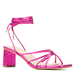 A metallic pink block-heeled sandal with thin ankle wrap straps and open toe design, displayed on a plain background.