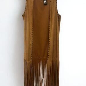 Faux Suede Fringe Vest in brown with sleeveless design, metal studs on the edges, and long fringe at the bottom, shown on a hanger against a white background.